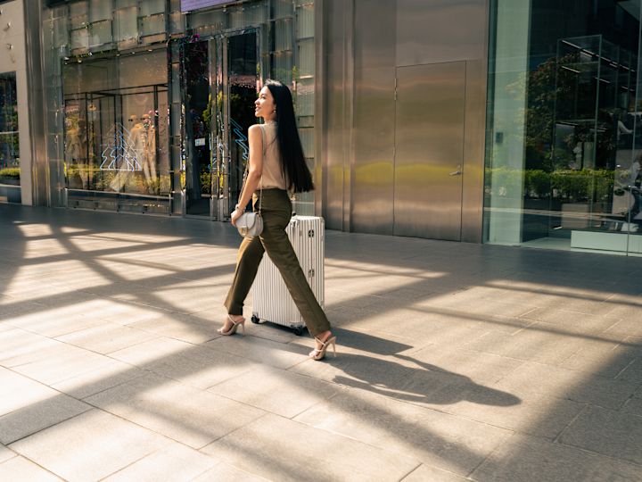 Woman Walking with Luggage
