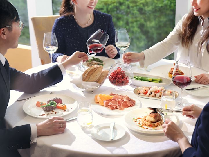 People round table enjoying meal