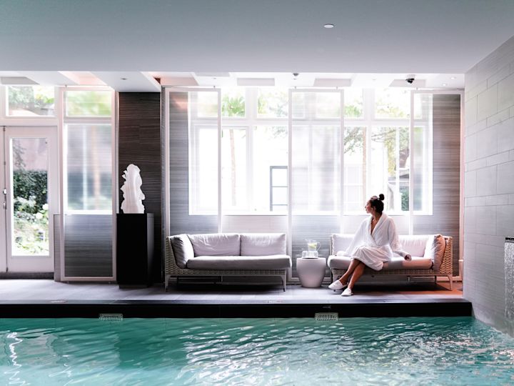 Lady Relaxing by the Pool at the Spa