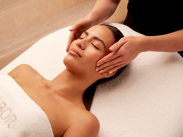 Woman Getting a Facial Massage at the Spa