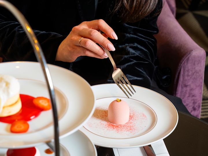 Woman Enjoying Dessert in a Restaurant