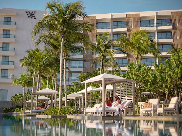 Exterior shot of Waldorf hotel with pool