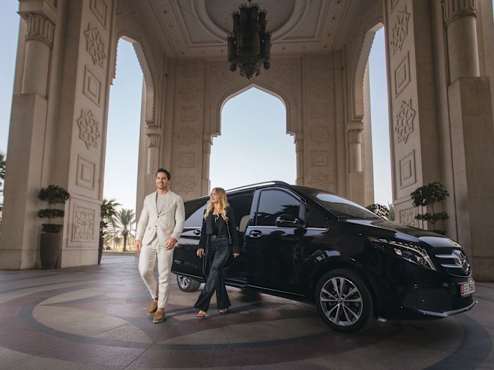 Couple Arriving at the Hotel in a Limousine