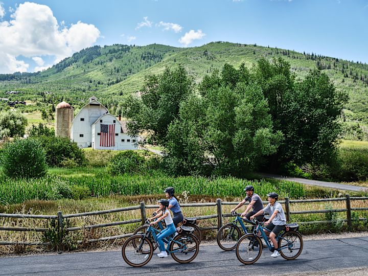 A Group of People Riding Bicycles Outdoors