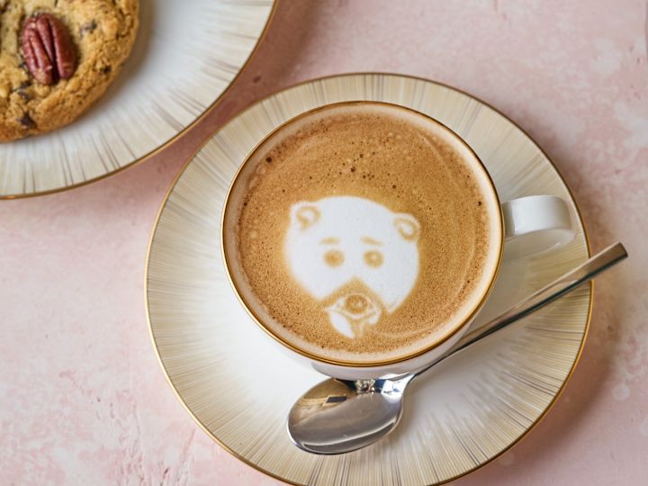 Cafe TOMO top down shot of coffee with bear design