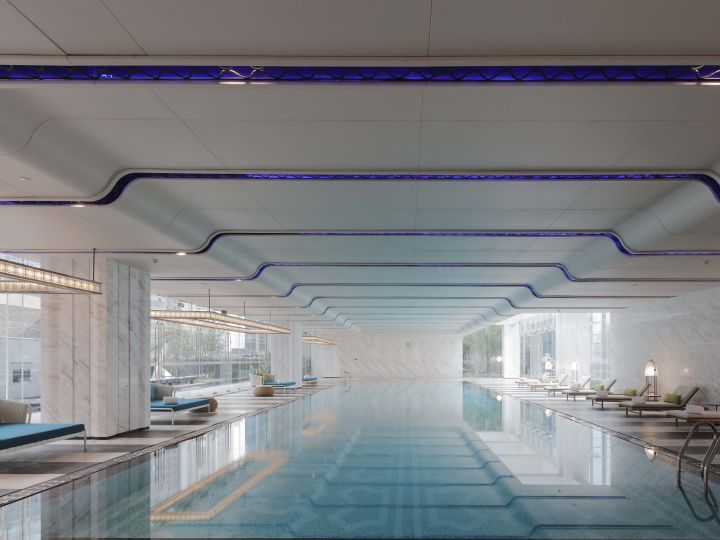 Swimming pool view with loungers