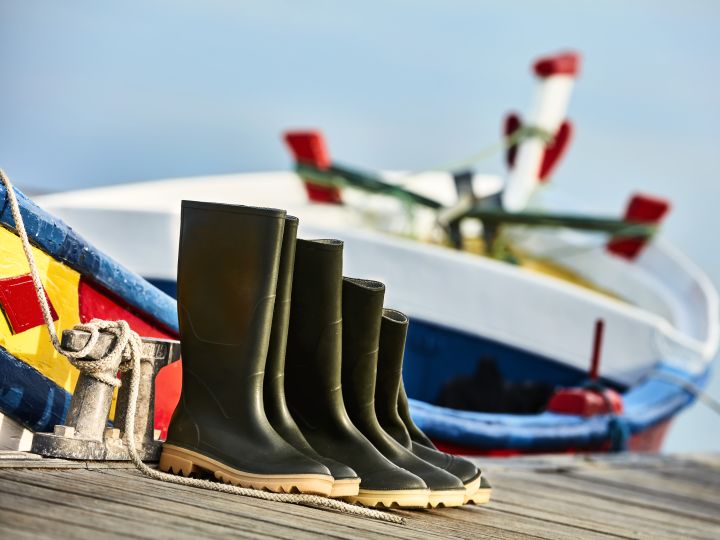rain boots on boat dock