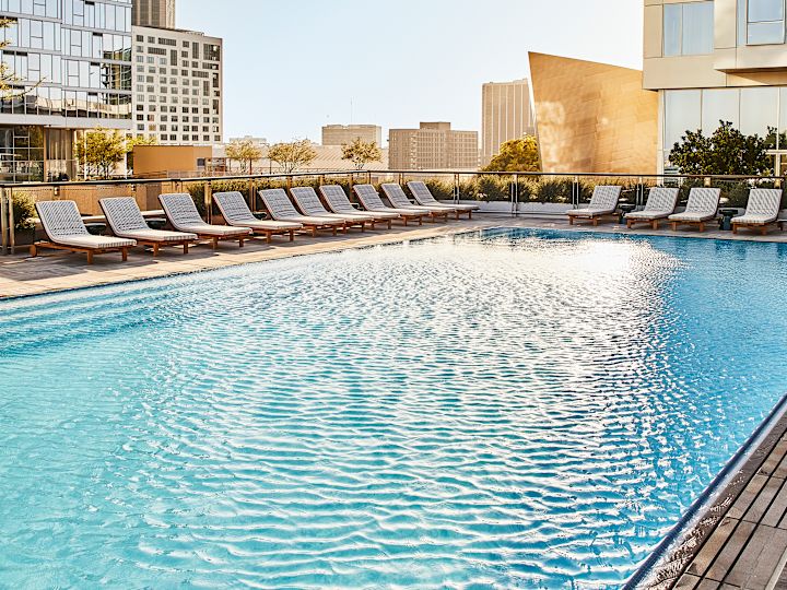 Outdoor pool with loungers