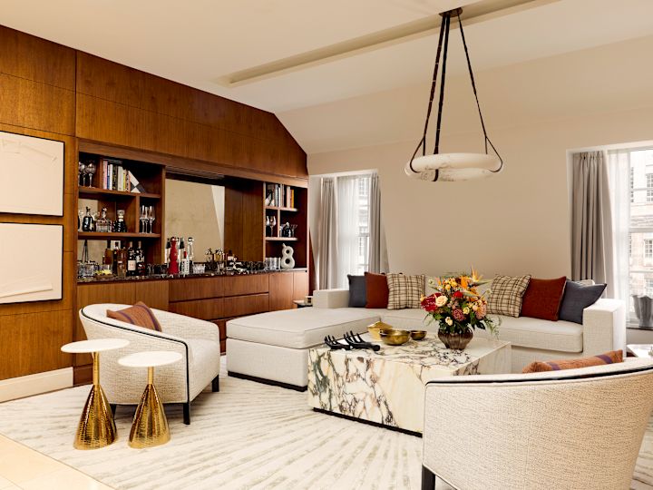 Suite Living Area with Cream Colored Sofas