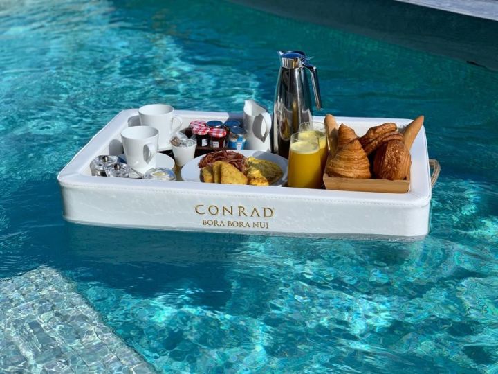 Breakfast tray floating in pool