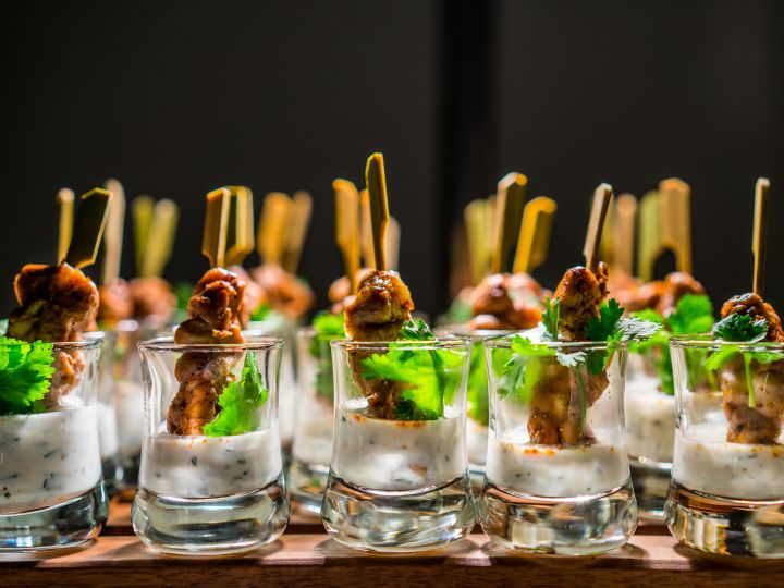 Chicken Satay served in glasses with sauce