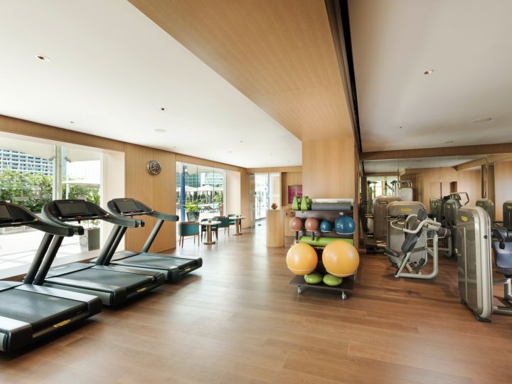 Treadmills by Large Windows, More Equipment in Fitness Center