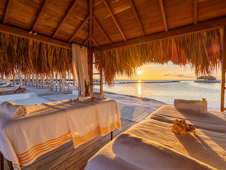 Massage Tables in a Covered Area Outdoors with View of the Beach