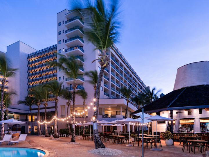 Water's Edge Beach Bar and View of Hotel Exterior in the Evening