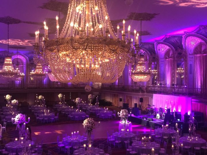 Ballroom with a large chandelier setup for a special event