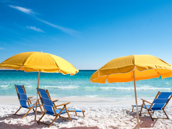 Deckchairs on beach with sea view