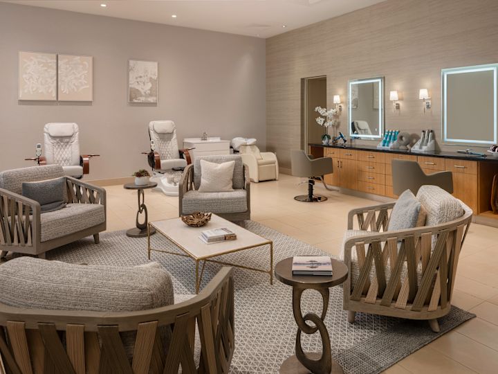 spa lounge area, pedicure chairs, salon chairs, mirrors