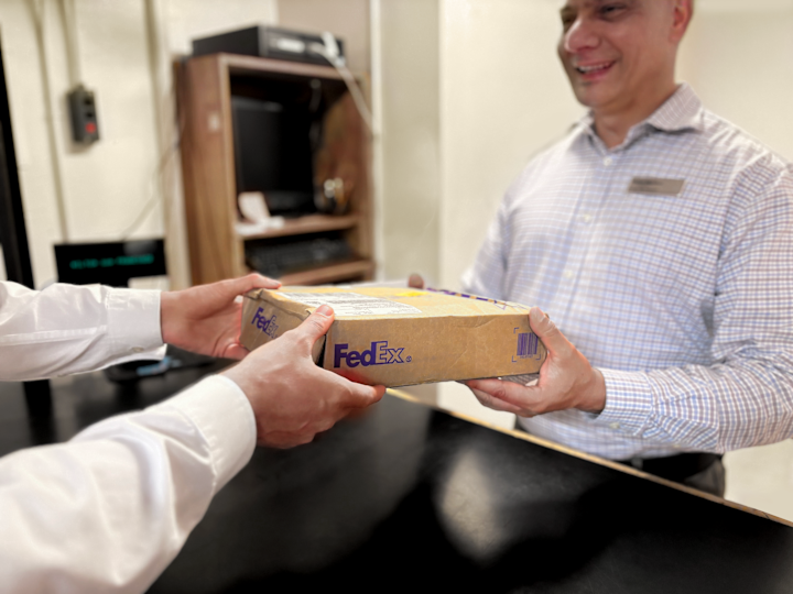 A Person Getting a FedEx Package