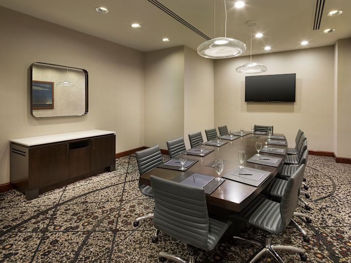 Presidio Meeting Room Setup with a Large Table and a TV