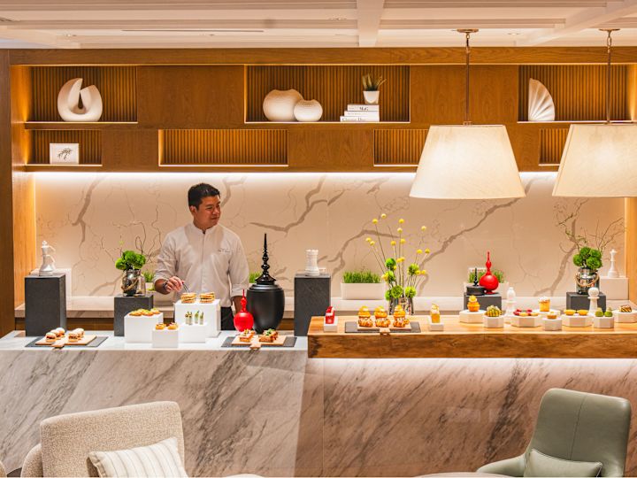 The Hilton Commune chef in preparing treats on table