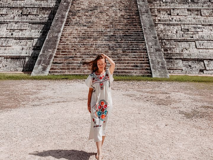woman in front of pyramid