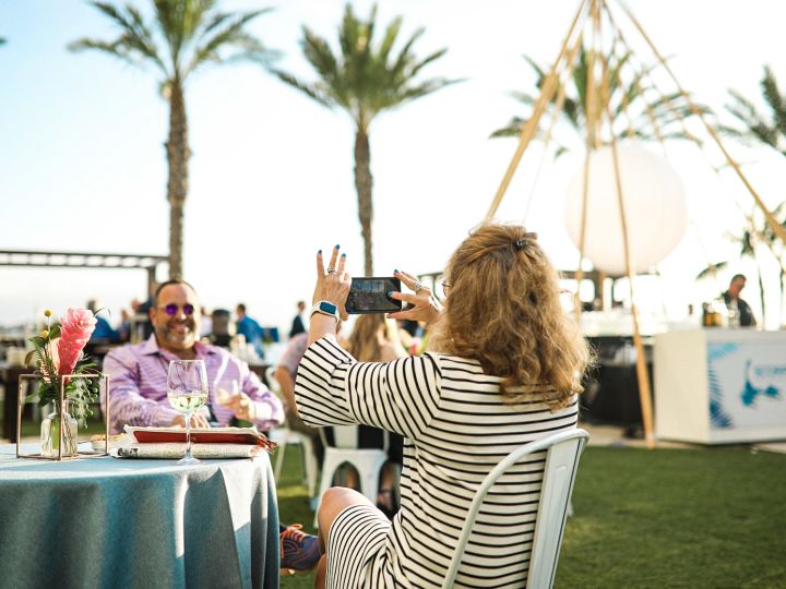 Guest taking a photo at an outdoor event