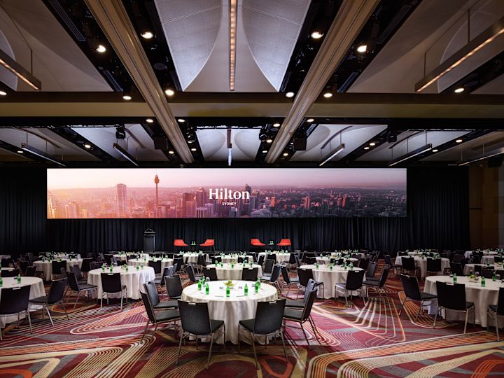 tables and large screen in Grand Ballroom