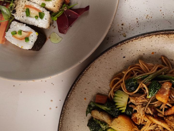 Pasta Dish and Sushi on Plates at Mowsem Restaurant