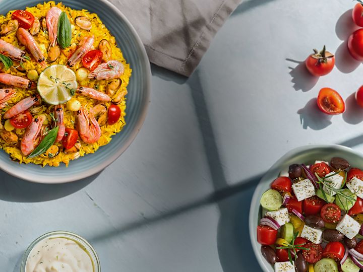 Paella and a Vegetable Salad on a Table at Mowsem Restaurant