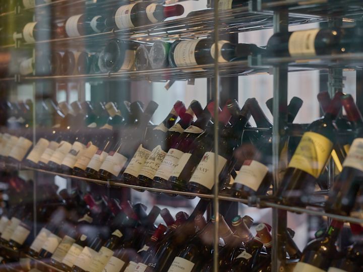 Wine Bottles on Shelves at the Glass Brasserie