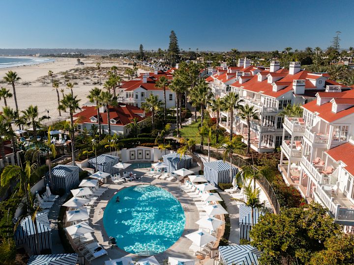 Aerial view of hotel and pool with beach view