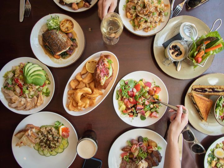 Herb N Kitchen top down view of selection of plates of food