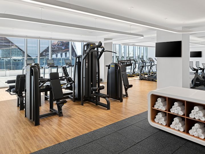 Fitness center with towels, TV and machines