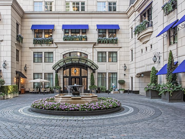 Hotel courtyard with flowers and water feature