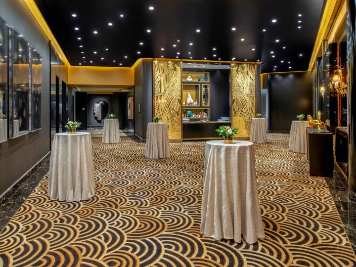 Ballroom foyer with tables and plants