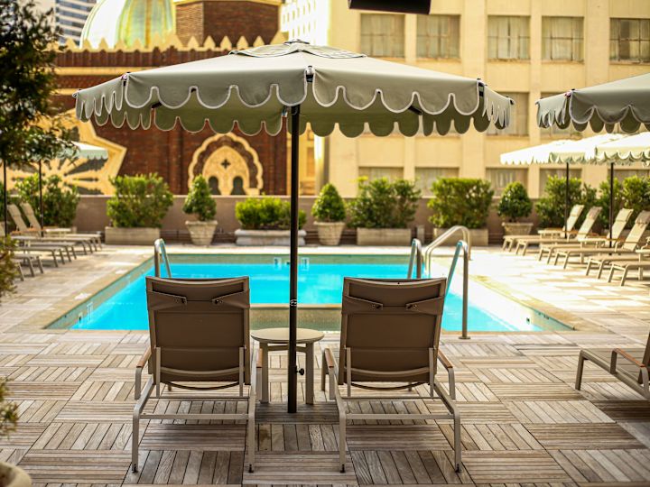 Seats under Umbrellas in Outdoor Pool Area