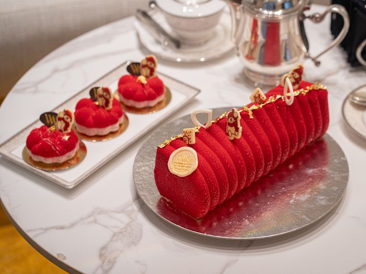Camelia Lounge setup with table featuring cakes and tea