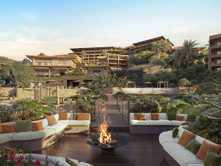 Outdoor seating area with fire pit and surrounding buildings