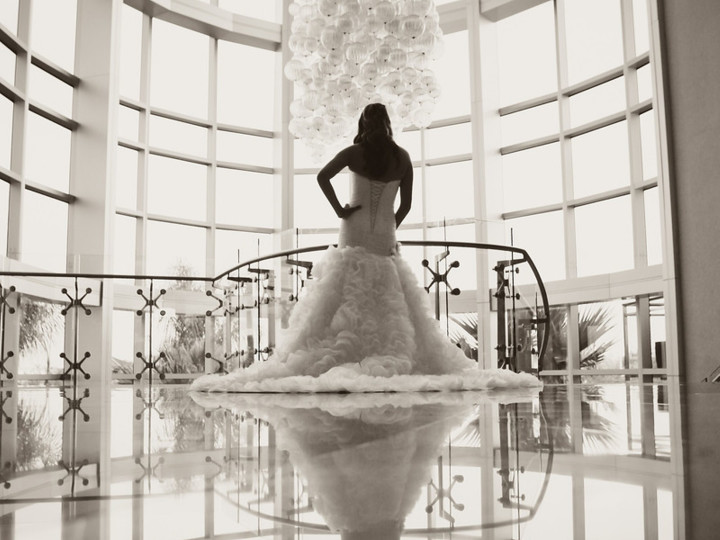 Bride standing by the lobby staircase