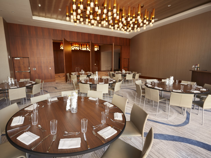 Spacious Ballroom Area with Round Tables and Chairs