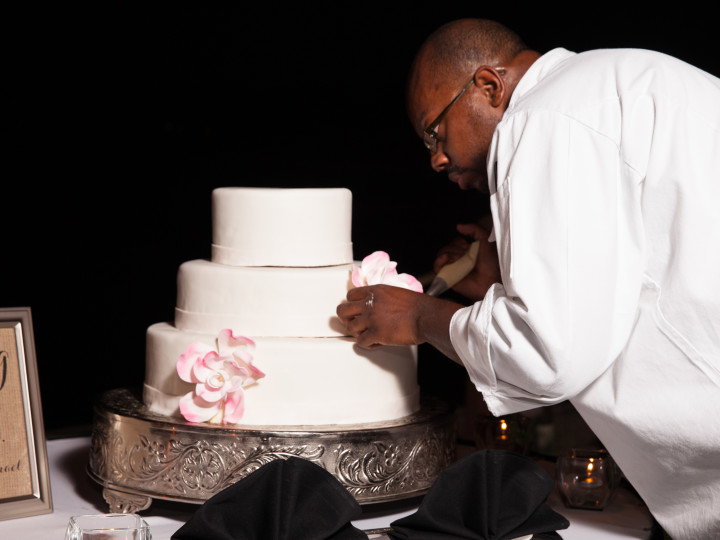 chef preparing a wedding cake