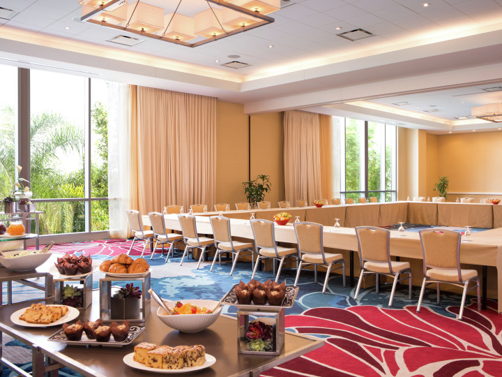 Meeting Room with Large Square Conference Table and Snack Table
