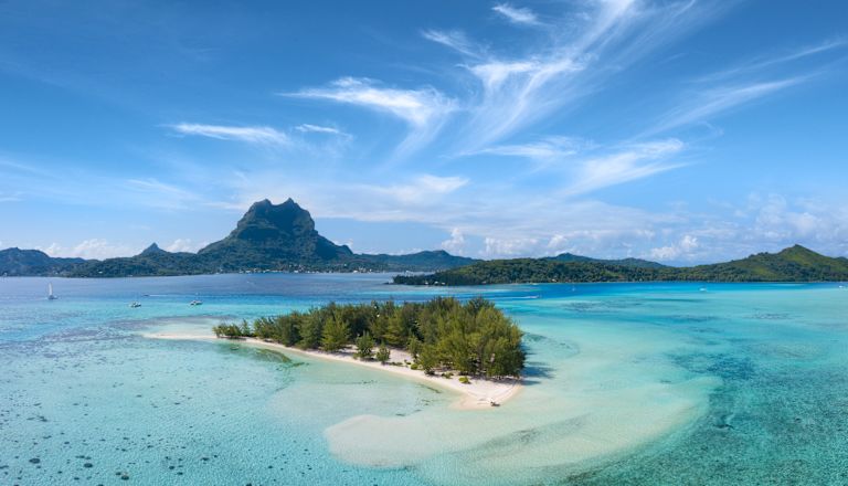 Panoramic view of an island and mountains in background