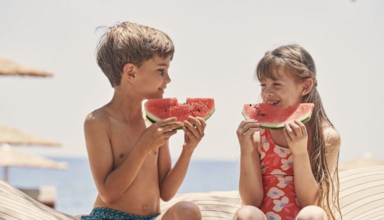 Kids Eating Watermelon at the Beach