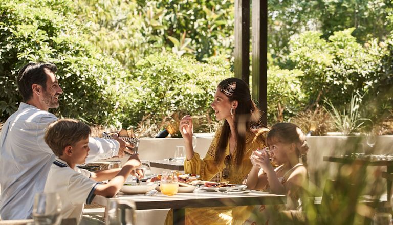 a Family Having Lunch in a Restaurants Terrace