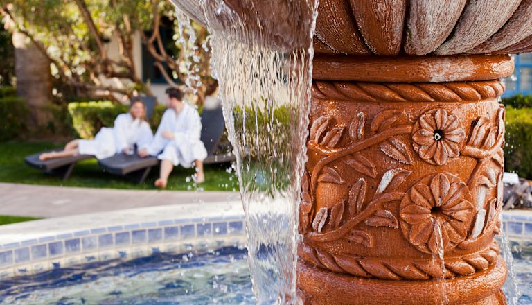 Water feature, with man and woman in background