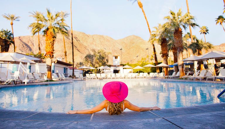 Woman relaxing by pool