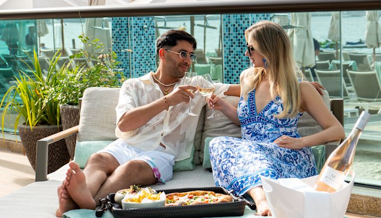 Couple Having Drinks and Snacks in a Terrace of a Restaurant