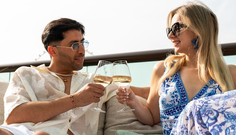 Couple Having Drinks and Snacks in a Restaurant