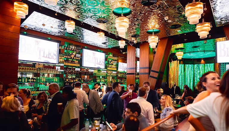 Interior of McGettigans bar with groups of people enjoying themselves
